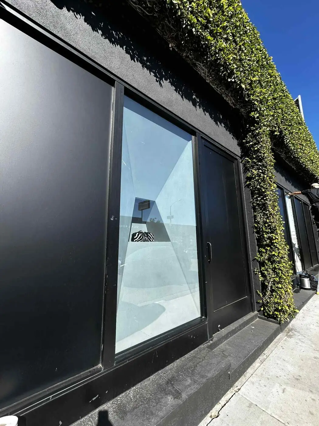 Reflective privacy film on a building's exterior glass