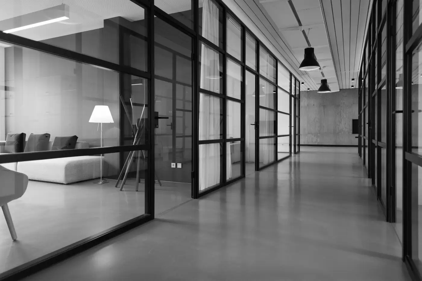 Office interior with floor-to-ceiling windows finished with solar control window film
